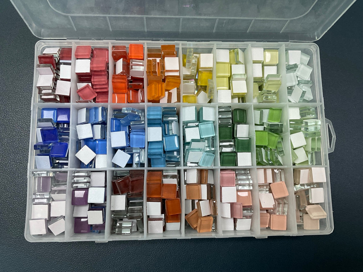 Real glass mosaic tiles sorted by color in the MosaicDIY studio